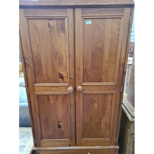 26 - A modern pine double wardrobe with two lower drawers - approx. 199cm high x 91cm wide x 54cm deep