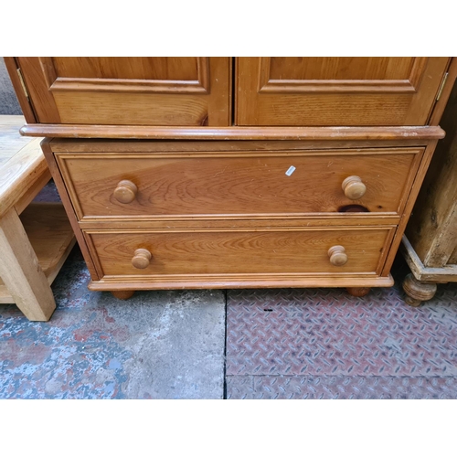 26 - A modern pine double wardrobe with two lower drawers - approx. 199cm high x 91cm wide x 54cm deep