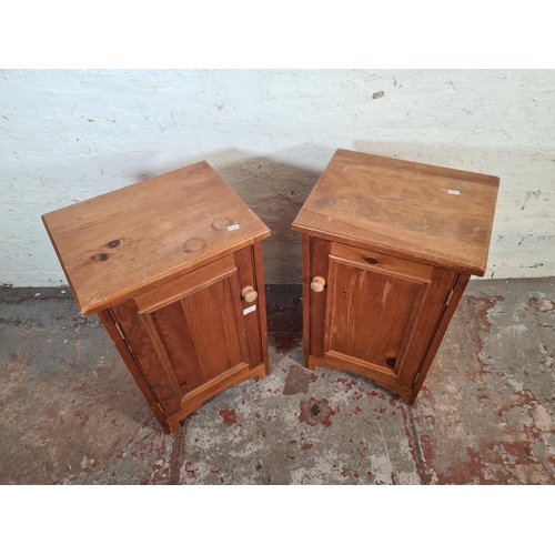 27 - A pair of modern pine bedside cabinets - approx. 69cm high x 42cm wide x 33cm deep