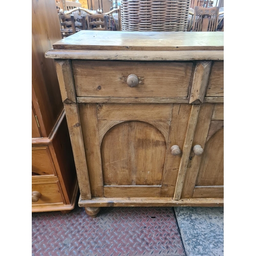 28 - A Victorian style solid pine sideboard with two drawers and two cupboard doors - approx. 96cm high x... 