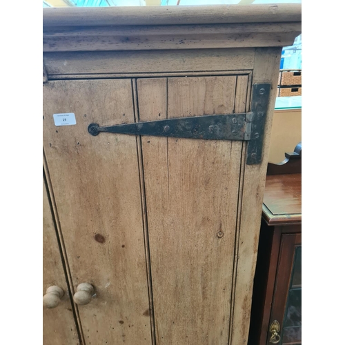 29 - A 19th century style solid pine two door cabinet with three internal shelves - approx. 144cm high x ... 