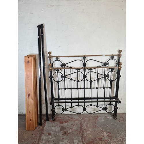 3 - A Victorian cast iron and brass double bed frame