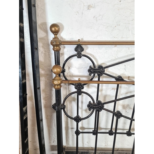 3 - A Victorian cast iron and brass double bed frame