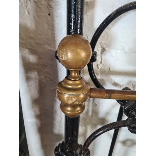 3 - A Victorian cast iron and brass double bed frame