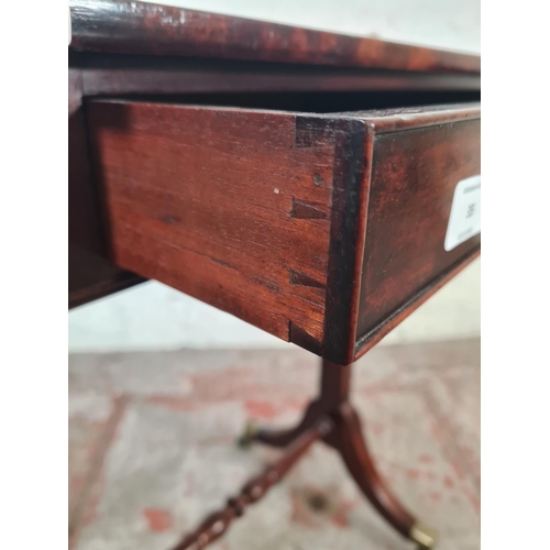 35 - A Regency mahogany rectangular side table with single drawer, lower stretcher and four brass castors... 