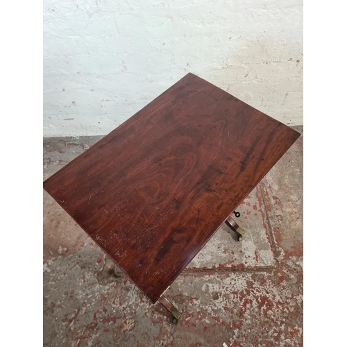 35 - A Regency mahogany rectangular side table with single drawer, lower stretcher and four brass castors... 