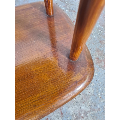 38 - A mid 20th century Ercol elm and beech three tier trolley on castors - approx. 71cm high x 90cm wide... 