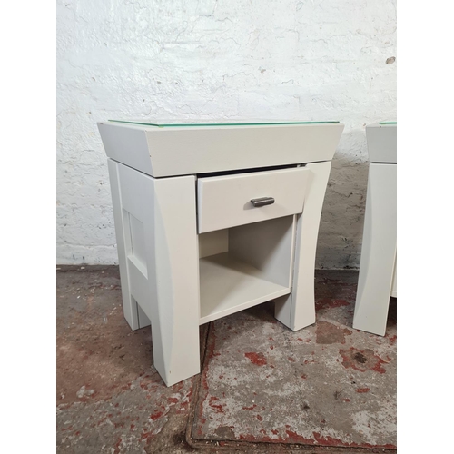 41 - A pair of modern grey painted bedside tables with glass tops and single drawer - approx. 60cm high x... 