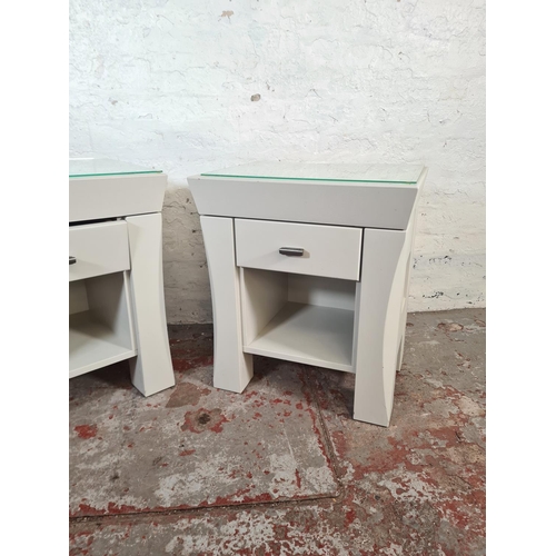 41 - A pair of modern grey painted bedside tables with glass tops and single drawer - approx. 60cm high x... 