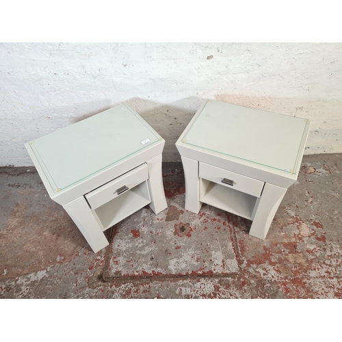 41 - A pair of modern grey painted bedside tables with glass tops and single drawer - approx. 60cm high x... 