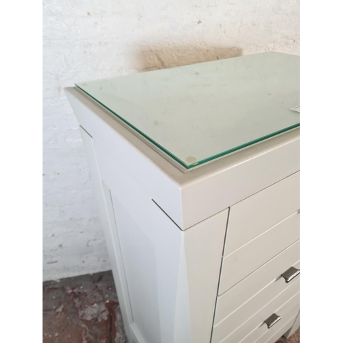 43 - A modern grey painted chest of four drawers with glass top - approx. 120cm high x 75cm wide x 47cm d... 