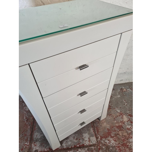 43 - A modern grey painted chest of four drawers with glass top - approx. 120cm high x 75cm wide x 47cm d... 