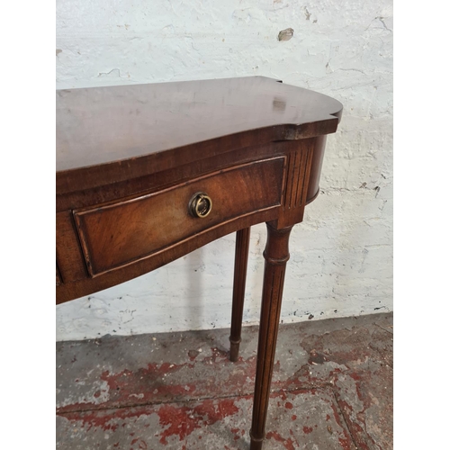 45 - A Bevan Funnell Ltd. Reprodux mahogany serpentine two drawer console table - approx. 73cm high x 79c... 