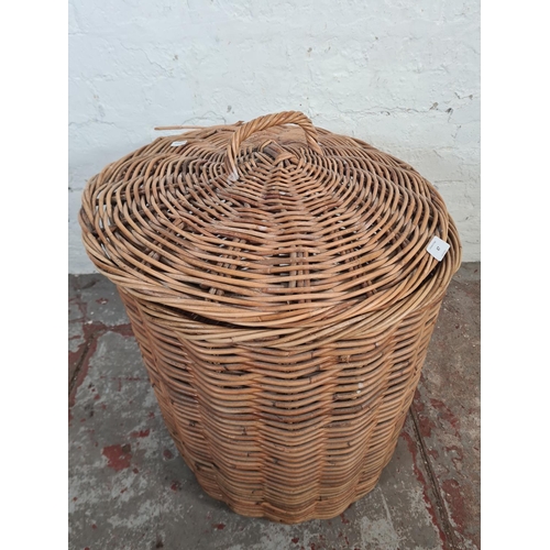 47 - A wicker cylindrical lidded basket - approx. 59cm high x 47cm diameter