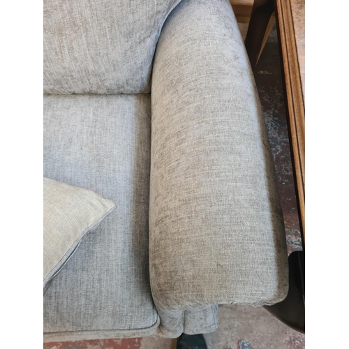 48 - A Parker Knoll grey fabric upholstered three seater sofa