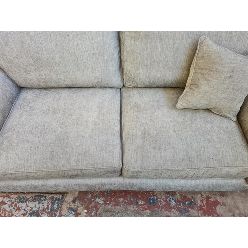 48 - A Parker Knoll grey fabric upholstered three seater sofa