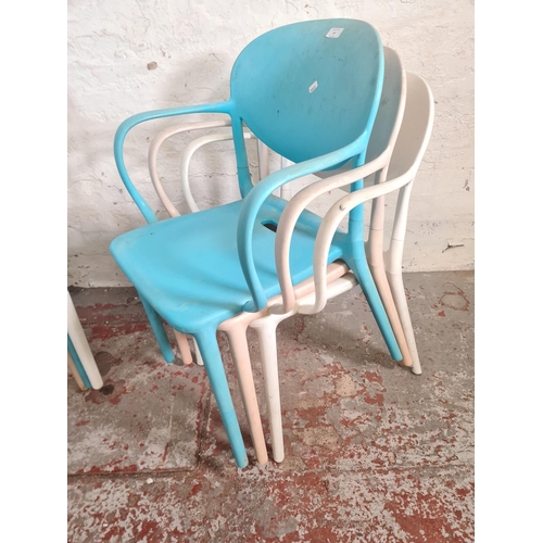 52 - Six plastic stackable dining chairs