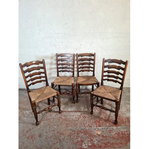 54 - Four 19th century style beech and elm rush seated Lancashire dining chairs