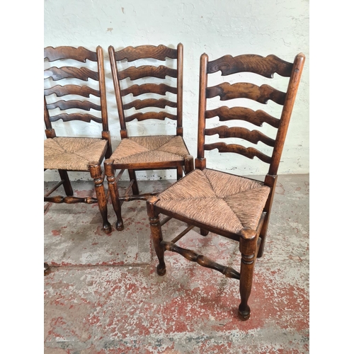 54 - Four 19th century style beech and elm rush seated Lancashire dining chairs