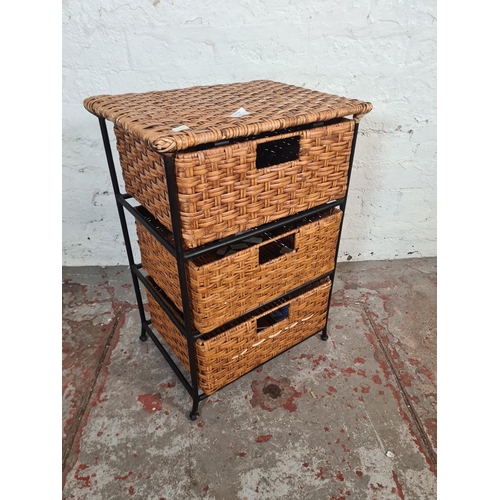 57 - A wicker and black metal chest of three drawers - approx. 62cm high x 44cm wide x 32cm deep