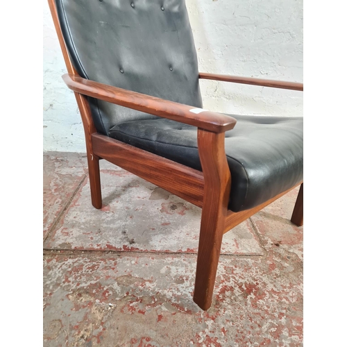 6 - A mid 20th century Cintique teak and black vinyl armchair - approx. 89cm high x 71cm wide x 64cm dee... 