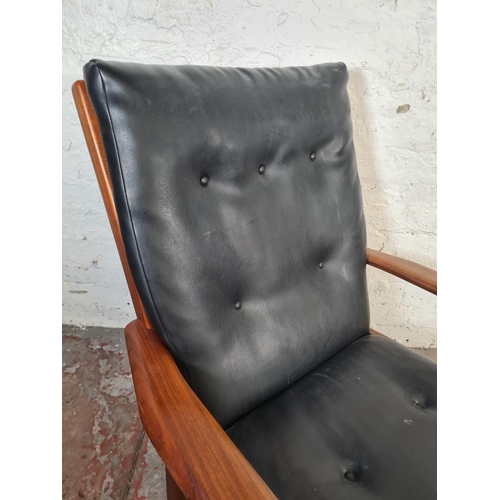 6 - A mid 20th century Cintique teak and black vinyl armchair - approx. 89cm high x 71cm wide x 64cm dee... 