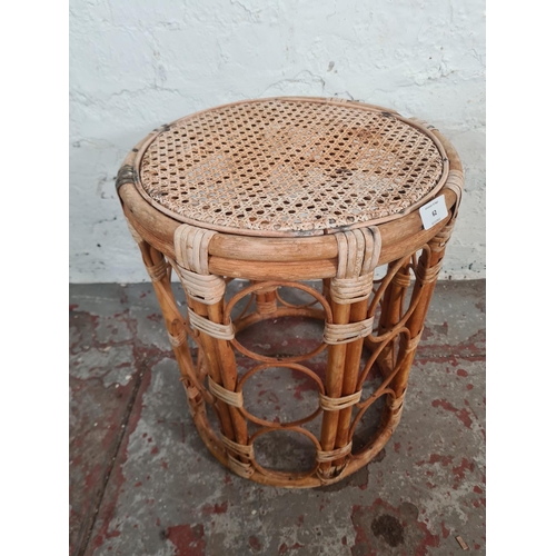 62 - A mid 20th century bamboo and wicker circular side table - approx. 47cm high x 38cm diameter