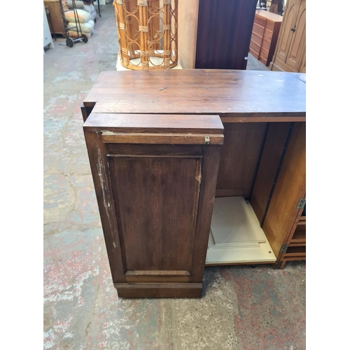 63 - A mid 20th century oak folding drinks cabinet/bar - approx. 97cm high x 183cm wide x 66cm deep