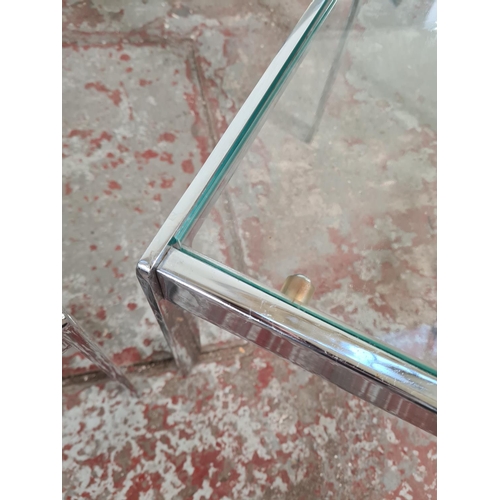 9 - A 1970s Merrow Associates chrome and glass nest of three tables - largest approx. 42cm high x 114cm ... 