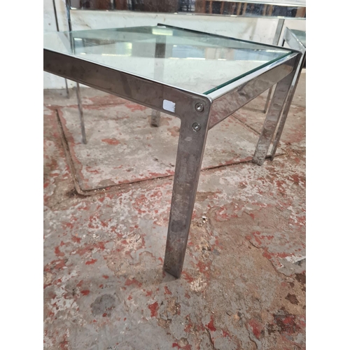 9 - A 1970s Merrow Associates chrome and glass nest of three tables - largest approx. 42cm high x 114cm ... 