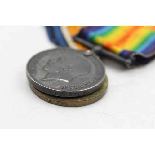 1159C - A WWI medal pair with original ribbons presented to 31074 PTE H.G Walters - Yorkshire Regiment