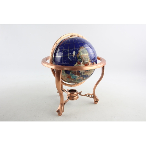 495 - A polished hardstone terrestrial world globe on copper stand