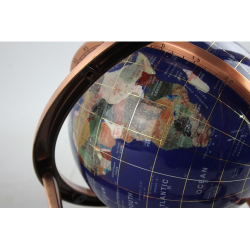 495 - A polished hardstone terrestrial world globe on copper stand