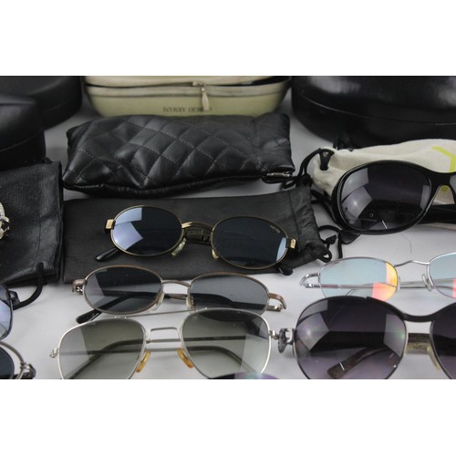 427 - A collection of sunglasses to include Armani, Calvin Klein, Guess etc.