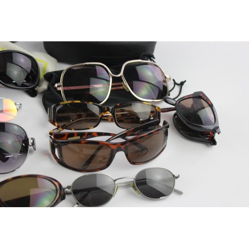 427 - A collection of sunglasses to include Armani, Calvin Klein, Guess etc.