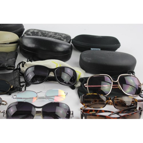 427 - A collection of sunglasses to include Armani, Calvin Klein, Guess etc.