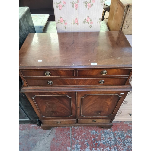 101 - A Regency style mahogany media cabinet with fall front and two cupboard doors