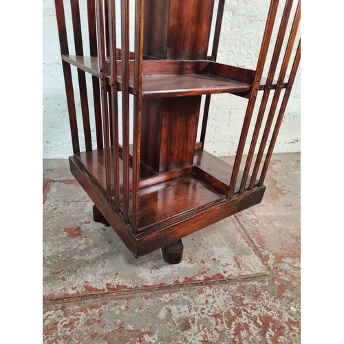 110 - An early 20th century mahogany revolving bookcase - approx. 84cm high x 46cm squared