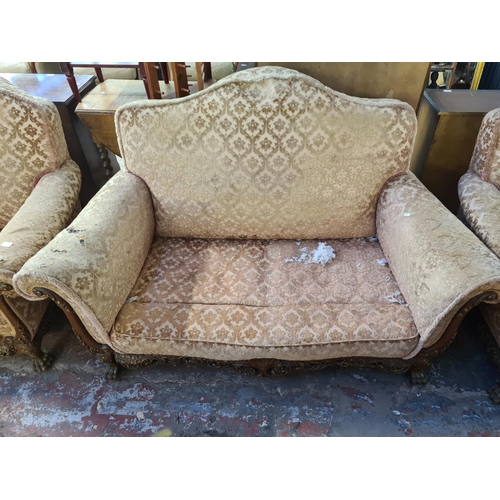 113 - A Georgian style mahogany and floral upholstered three piece lounge suite comprising two seater sofa... 