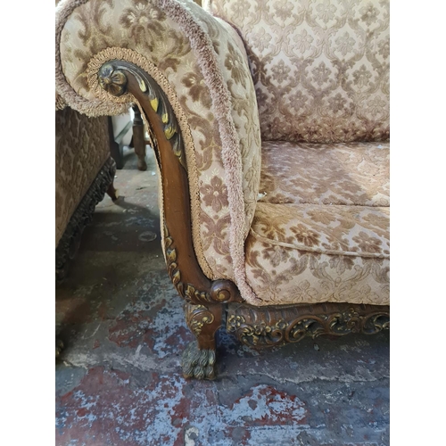 113 - A Georgian style mahogany and floral upholstered three piece lounge suite comprising two seater sofa... 