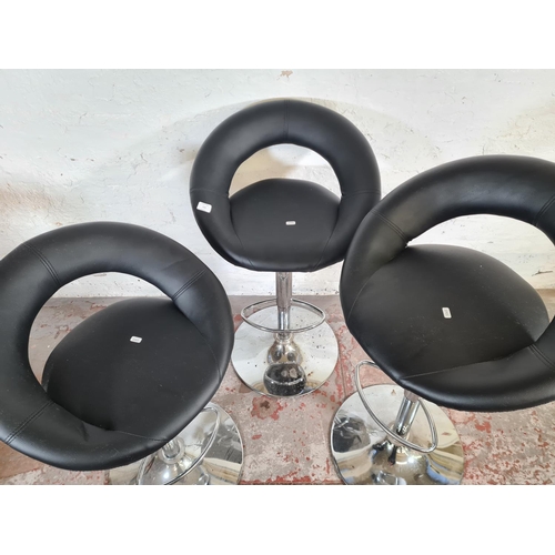 114 - Three modern black leatherette and chrome plated kitchen barstools