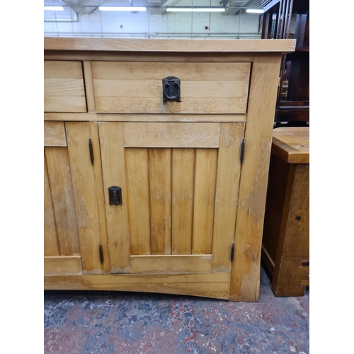 121 - A modern solid oak sideboard with three drawers and three cupboard doors - approx. 87cm high x 154cm... 