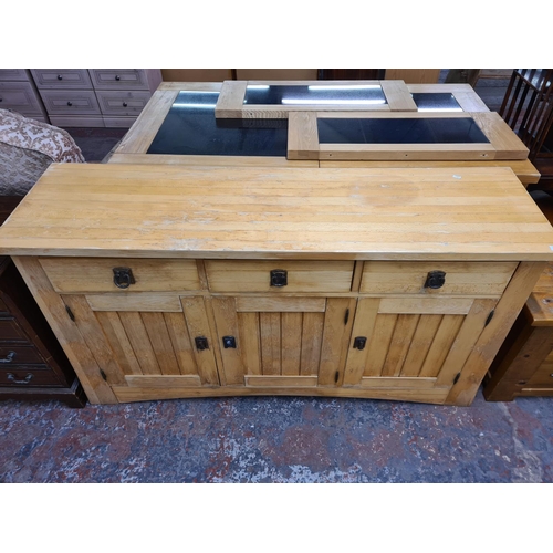 121 - A modern solid oak sideboard with three drawers and three cupboard doors - approx. 87cm high x 154cm... 