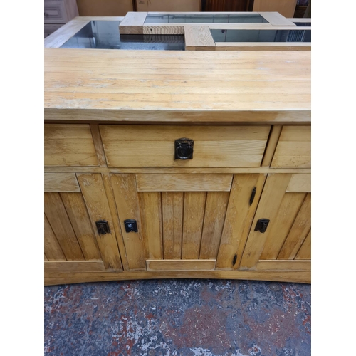 121 - A modern solid oak sideboard with three drawers and three cupboard doors - approx. 87cm high x 154cm... 