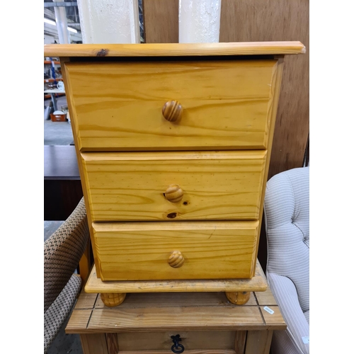 128 - Two modern pine bedside chests of three drawers - largest approx. 67cm high x 55cm wide x 41cm deep