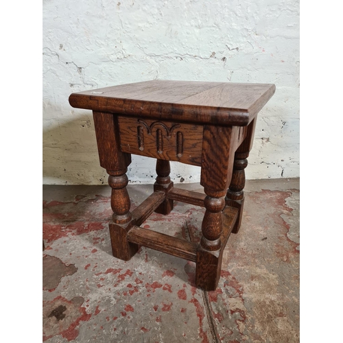 134 - A pair of 17th century style solid oak joint side tables - approx. 40cm high x 33cm square