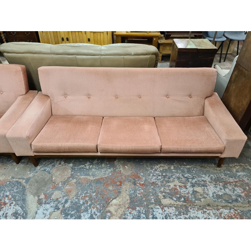 140 - A 1960s G Plan Danish range pink fabric and teak framed three piece lounge suite designed by Ib Kofo... 