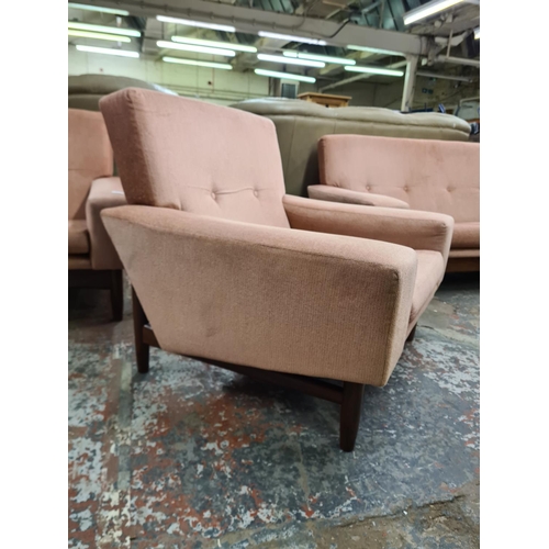 140 - A 1960s G Plan Danish range pink fabric and teak framed three piece lounge suite designed by Ib Kofo... 