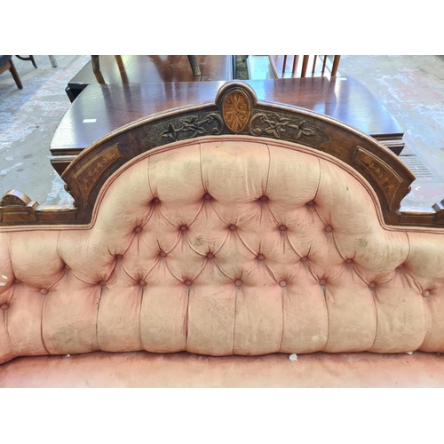 67 - A Victorian inlaid walnut and pink fabric upholstered parlour sofa - approx. 100cm high x 170cm wide... 