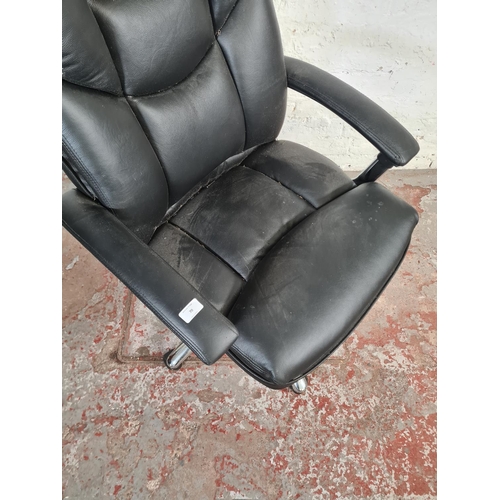 70 - A modern black leatherette and chrome plated swivel office desk chair